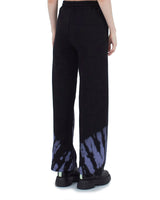 Comme Des Fuckdown Abstract Print Palazzo Pants with Bold Logo